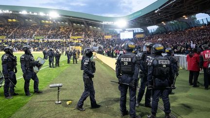 French riot police restoring order at Stade de la Beaujoire after pitch invasion