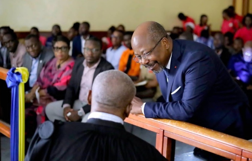Alain-Claude Bilie By Nze with his lawyer during a court hearing on social media-related charges
