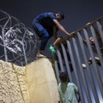 Hundreds of migrants reach Spain's Ceuta after swimming from Morocco