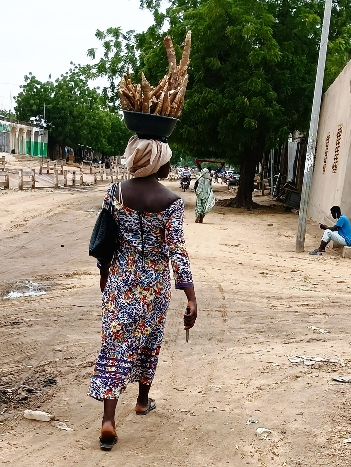 In N'Djamena, a student sells cassava during holidays to pay for school