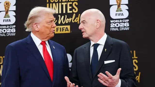 Donald Trump and Gianni Infantino at a press conference during the 2026 World Cup.